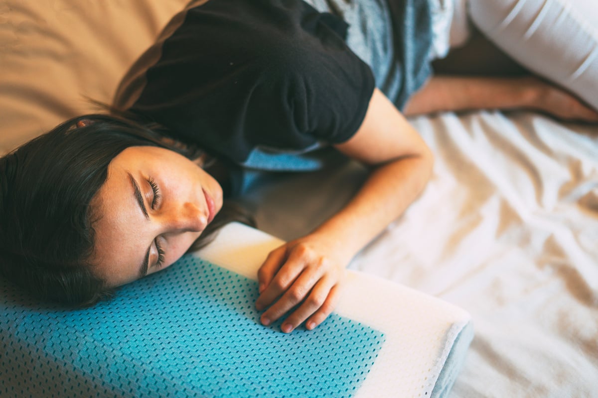 Woman Sleeping on an Ergonomic Pillow. Ergonomic and Comfortable